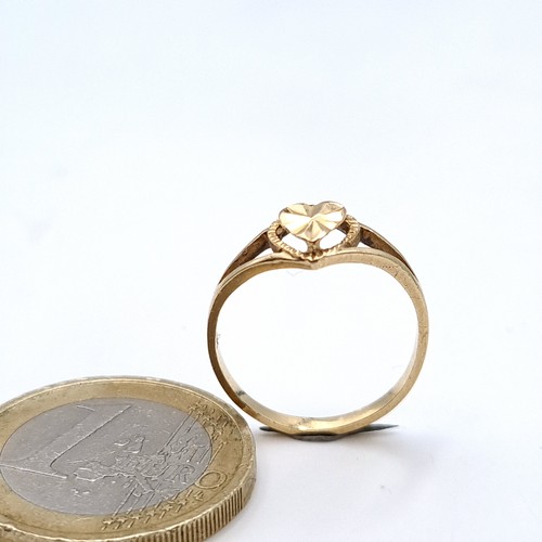 729 - A 14K gold heart shaped diamond ring, ring size J, weight 1.21 grams.