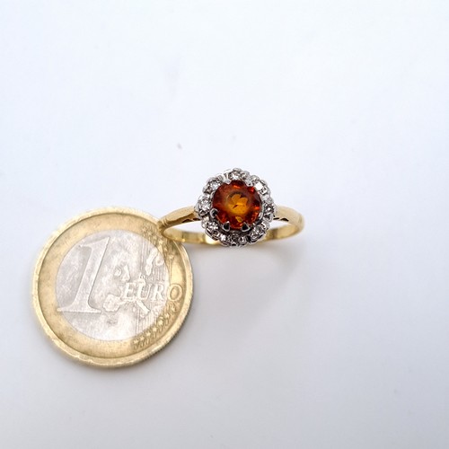 737 - A 9K gold topaz gemstone ring set with diamond cluster surround, ring size Q, weight 2.8 grams, boxe... 