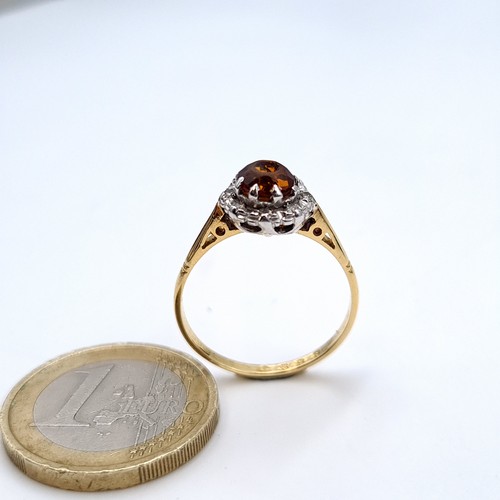 737 - A 9K gold topaz gemstone ring set with diamond cluster surround, ring size Q, weight 2.8 grams, boxe... 