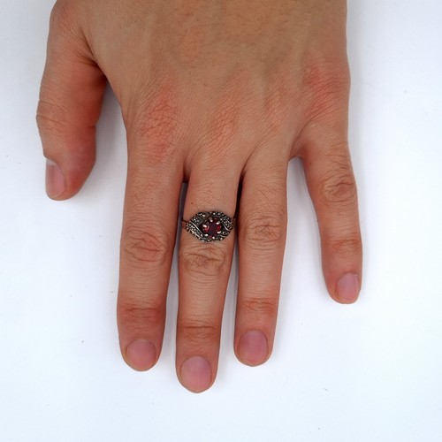 739 - A nice example of an art deco  garnet stone vintage sterling silver ring with a twist set marcasite ... 