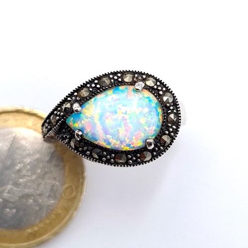 741 - A pretty art deco Opal tear drop stone ring set with marcasite surround set in sterling silver, ring... 