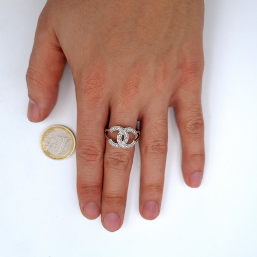 745 - Star Lot : A Chanel Style brilliant cut diamond dress ring set in 9K white gold (375), size S, weigh... 