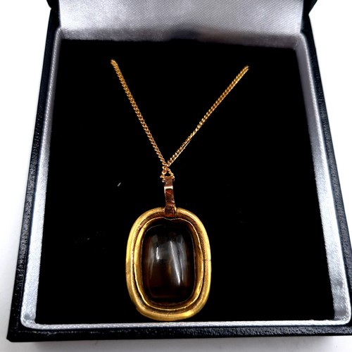 746 - A Victorian citrine intaglio stone mounted in gold together with chain, length 44cm, weight 5.8 gram... 