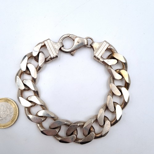 747 - A fine example of a sterling silver heavy chain link bracelet set with lobster clasp, weight an exce... 