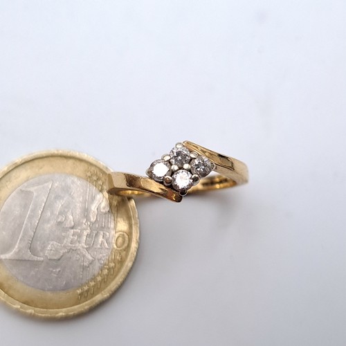 750 - Star Lot : A super pretty 9K gold brilliant cut four stone crossover ring, diamond weight .25cts, st... 