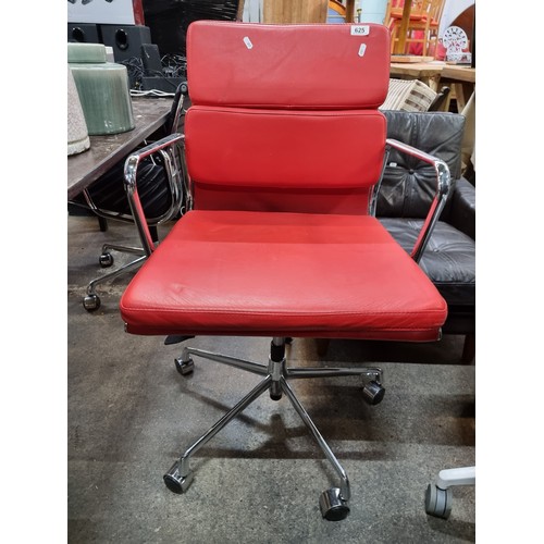 625 - Star Lot : A Charles Eames style soft pad striking red leather swivel chair with chrome frame. In ni... 