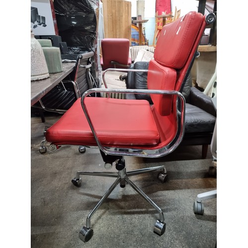 625 - Star Lot : A Charles Eames style soft pad striking red leather swivel chair with chrome frame. In ni... 