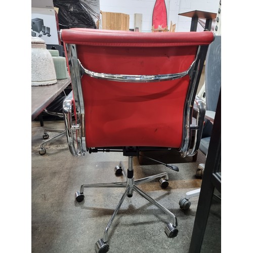 625 - Star Lot : A Charles Eames style soft pad striking red leather swivel chair with chrome frame. In ni... 