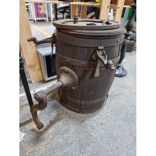 608 - A fabulous antique butter churn barrel with metal hardware.