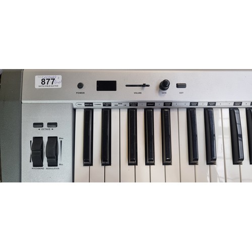 877 - A superb Swissonic Easykey 61 keyboard complete with stand. Features 61 Full-size velocity-sensitive... 