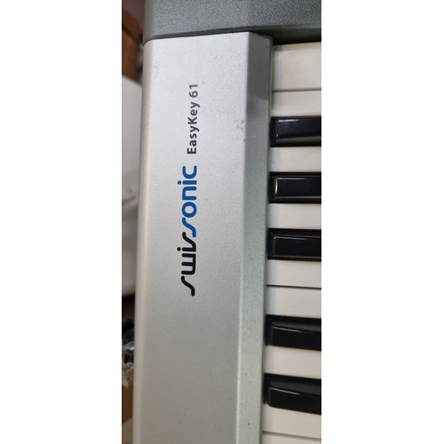 877 - A superb Swissonic Easykey 61 keyboard complete with stand. Features 61 Full-size velocity-sensitive... 