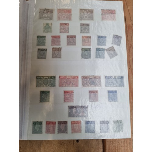 223 - A stamp album containing 32 pages with mainly English stamps including examples depicting Queen Vict... 