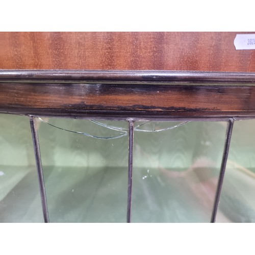 649 - An Edwardian mahogany bow front display cabinet. Astroglazed front with stunning stained glass detai... 