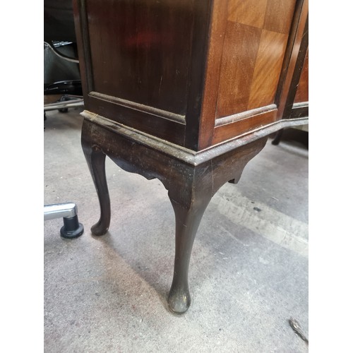 649 - An Edwardian mahogany bow front display cabinet. Astroglazed front with stunning stained glass detai... 