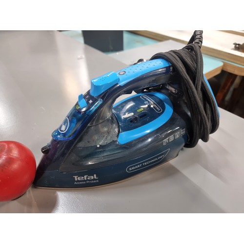 909 - An and new high quality Tefal Access Protect iron accompanied by a large commercial quality foldable... 