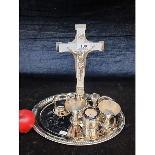 108 - An ornate church communion set comprising of a crucifix with a mother of pearl effect, tray, cups an... 