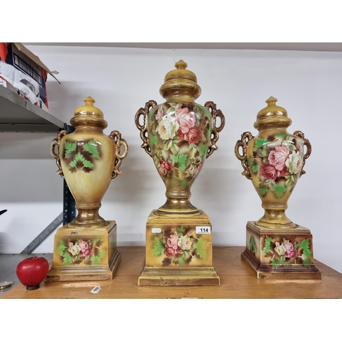 114 - Star Lot : A gorgeous set of three very large early 20th century lidded urns boasting an ornate rose... 