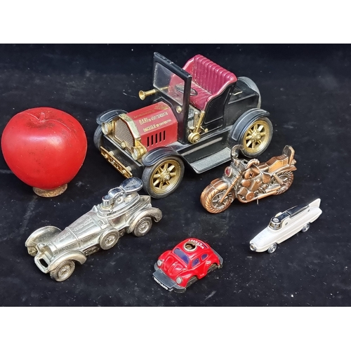 116 - Five interesting motor themed lighters including rare examples including a  large car Peugeot exampl... 