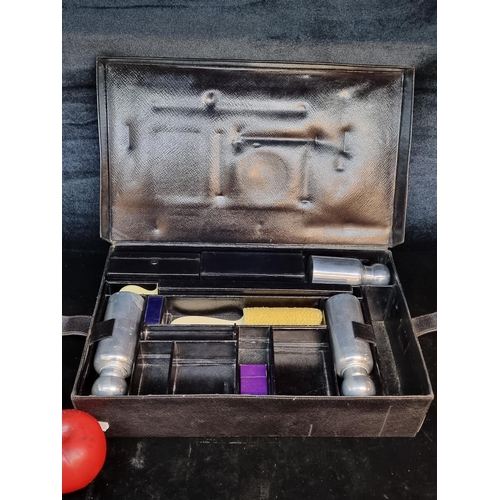 118 - A handsome vintage gentlemen's vanity set containing three most likely silver bottles (no hallmarks)... 