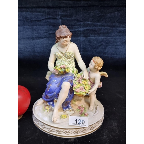 120 - A highly ornate porcelain figure depicting a lady accompanied by a cupid gifting her flowers. Unusua... 