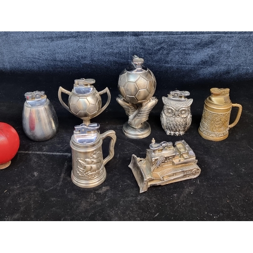 125 - A collection of 7 metal table lighters including examples in the form of footballs, beer steins, a t... 