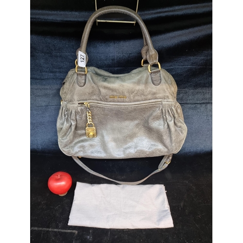 127 - Star Lot : A stylish Miu Miu Made in Italy handbag crafted from soft leather in a grey finish. With ... 