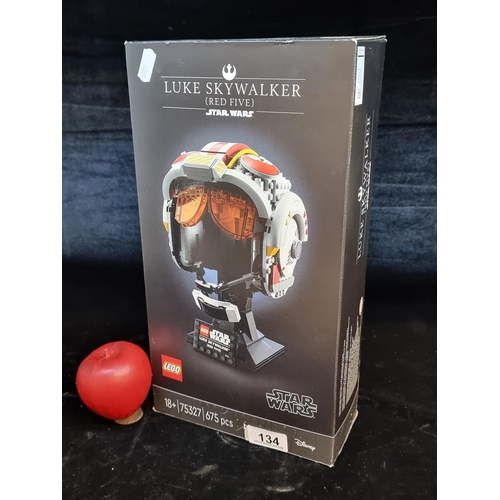 134 - A Lego Star Wars set of the Luke Skywalker (Red Five) helmet. With original box. Unchecked. With RRP... 