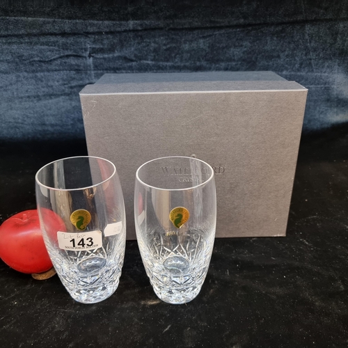 143 - A pair of highball Waterford Crystal glasses in the 'Lismore Essence' pattern. In very good conditio... 