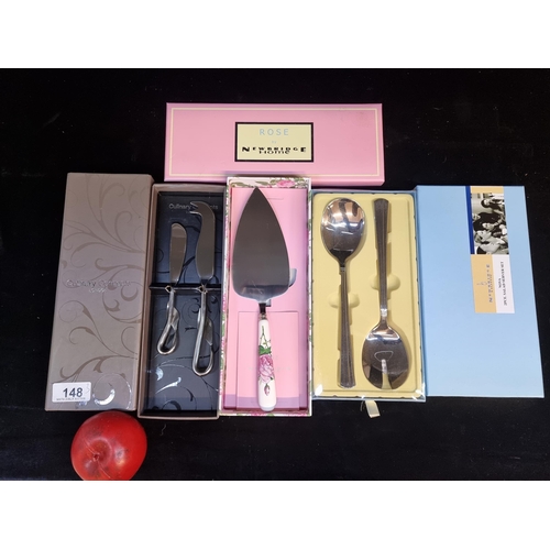 148 - Three elegant sets of serving cutlery including Newbridge Home salad servers and cake server. Along ... 