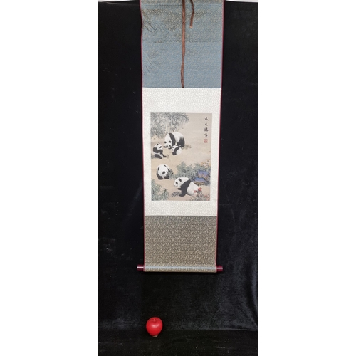 182 - A fabulous silk Chinese wall hanging featuring a family of adorable pandas. In a cardboard tube.