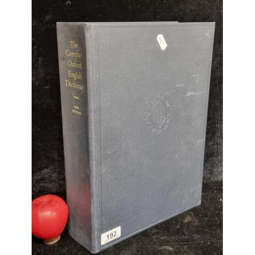 A superb large hardback book titled "The Compact Oxford English Dictionary" Second Edition.