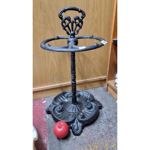 195 - A beautiful  heavy cast metal pierced umbrella stand.