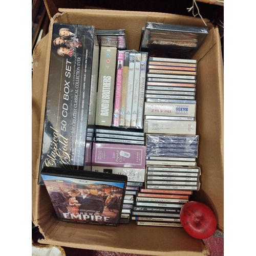 205 - A large impressive collection of both CD's and DVD's. Including sealed boxsets. etc