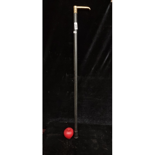 213 - A fabulous vintage walking stick / cane with thick brass handle, boasting an inlaid compass to top.