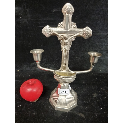 216 - A fabulous vintage ecclesiastical cast metal candle holder featuring a crucifixion scene scene to ce... 