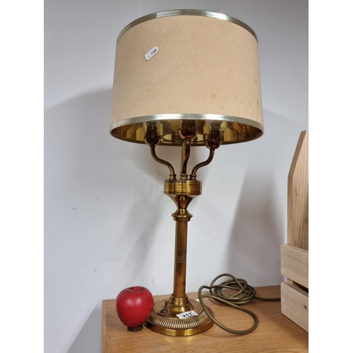 217 - A very handsome brass table lamp with a lovely reeded stem, fitted with three branches and topped wi... 