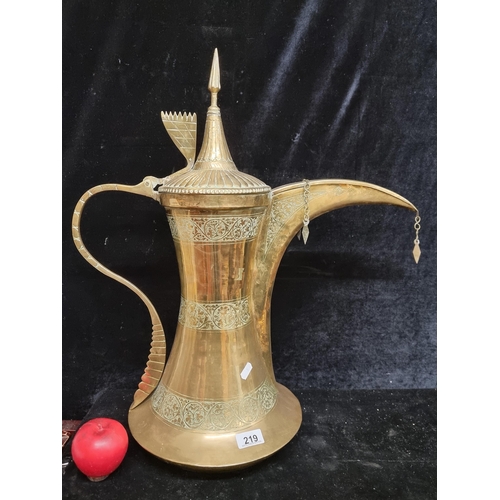 219 - A magnificent very large 20th century Dallah (traditional Arabic coffee pot). Crafted from brass, th... 