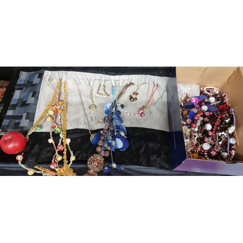 239 - A box full of mixed costume jewellery including necklaces, watches and bracelets. A great dealers lo... 