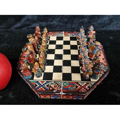 241 - A beautiful and charming carved wooden travelling Mexican chess set with llamas for knights.