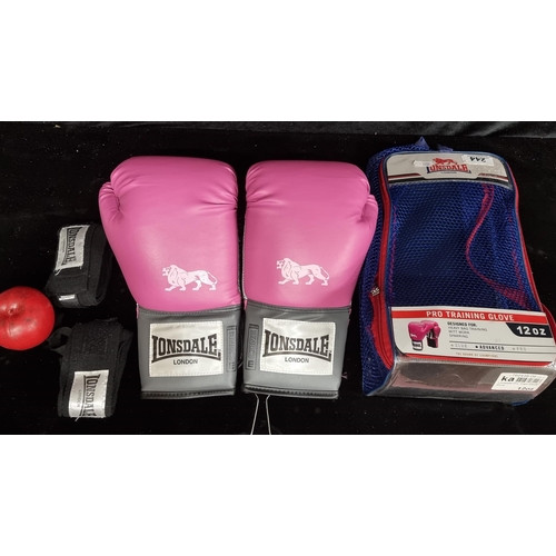 244 - A pair of candy pink Lonsdale London Boxing gloves. Unworn in original packaging.