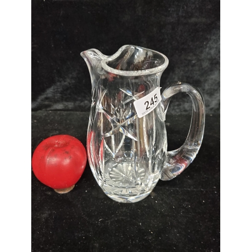 245 - An elegant Waterford Crystal water Whisley jug / pitcher. In good condition with acid mark to base.