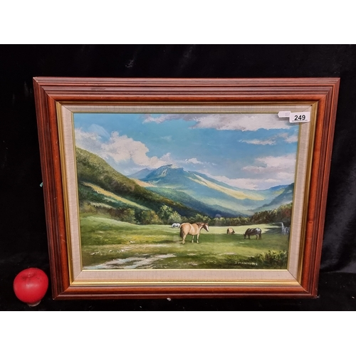 249 - An original oil on board painting featuring a rural landscape scene of a grassy valley populated wit... 