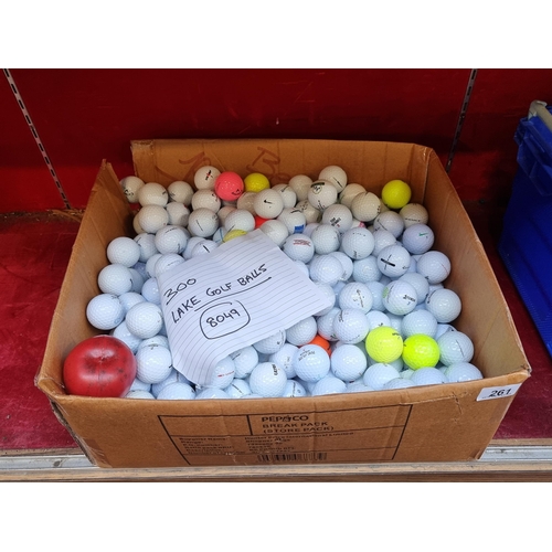 261 - Approximately 300 used golf balls from brands such as Wilson, Titleist and Nike.