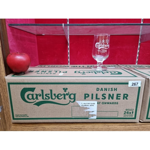 267 - A box of 24 brand new Carlsberg branded half pint glasses. All in very good condition.