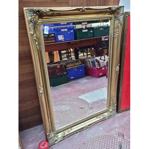 273 - A fabulous high quality Chippendale style beveled wall mirror, held in an elaborate gilt frame with ... 