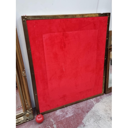 274 - A large vintage commercial menu board, featuring a bright red ribbed fabric pin board held in a bras... 