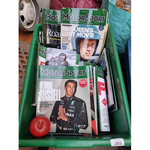 282 - A large collection of approx. 35 car magazines and 2 manuals. Including a hardback manual for Triump... 