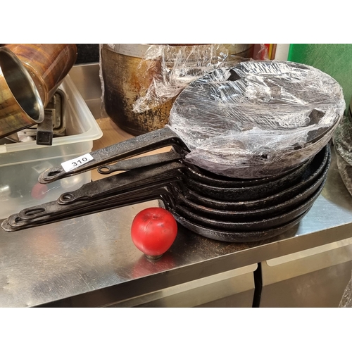 310 - Approximately 10 cast iron skillets. Commercial quality from a recently closed down restaurant in ce... 