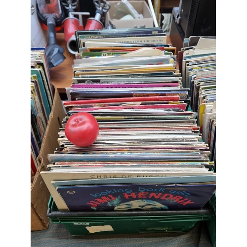 318 - A large and impressive collection of vinyl records from various different artists and genres. Unchec... 