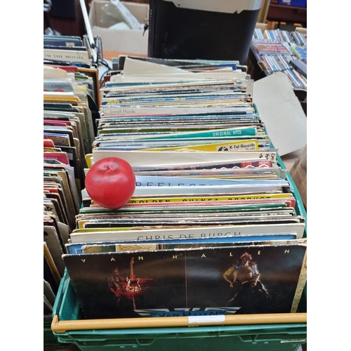 319 - A large and impressive collection of vinyl records from various different artists and genres. Unchec... 